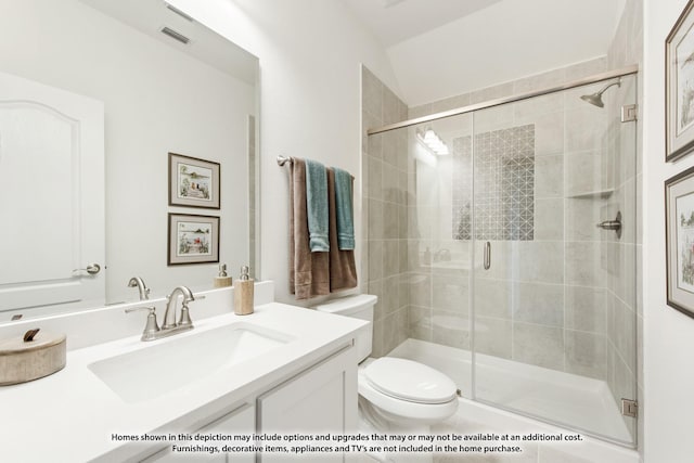 full bath with visible vents, a stall shower, vanity, and toilet