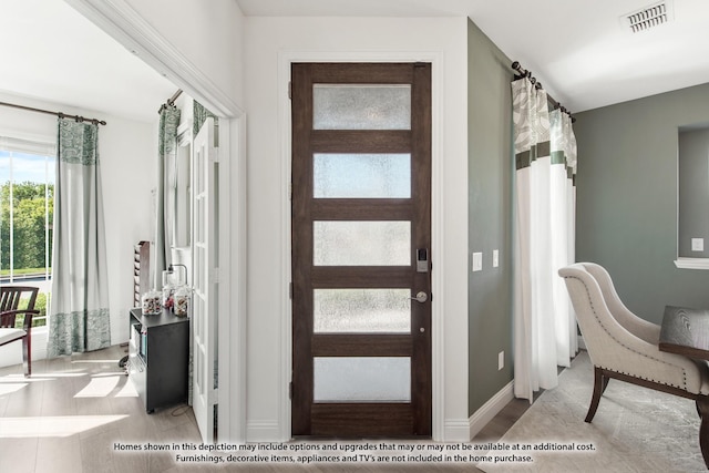 entrance foyer with visible vents and baseboards