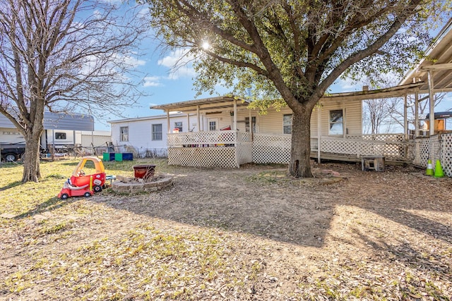 view of front of home featuring a fire pit