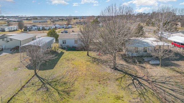 birds eye view of property with a residential view