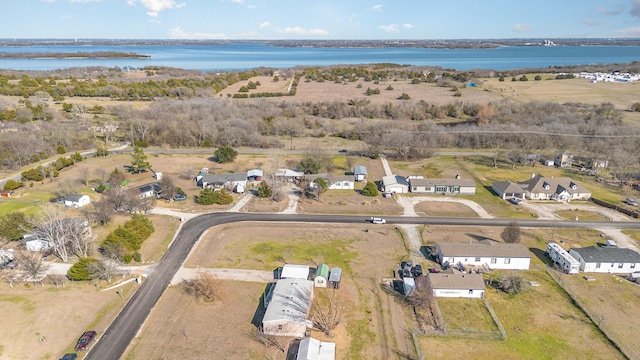 bird's eye view featuring a water view and a residential view