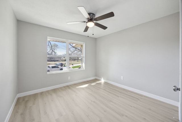 unfurnished room with light wood-style flooring, baseboards, and ceiling fan