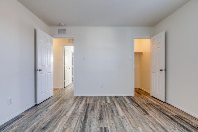 2305 Simmental Rd, Fort Worth, TX 76131 - unfurnished bedroom with wood finished floors and baseboards