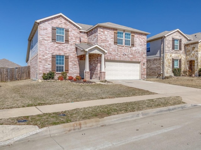 view of front of property with a garage, concrete driveway, brick siding, and fence