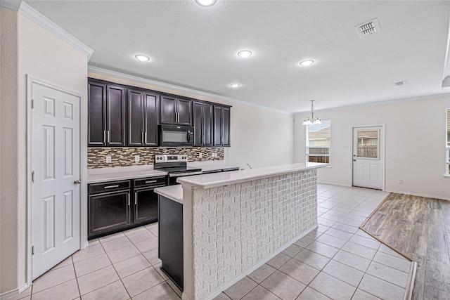 2305 Simmental Rd, Fort Worth, TX 76131 - kitchen featuring electric range, black microwave, crown molding, light countertops, and backsplash