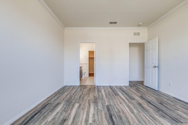 2305 Simmental Rd, Fort Worth, TX 76131 - unfurnished bedroom with ornamental molding, wood finished floors, baseboards, and ensuite bathroom