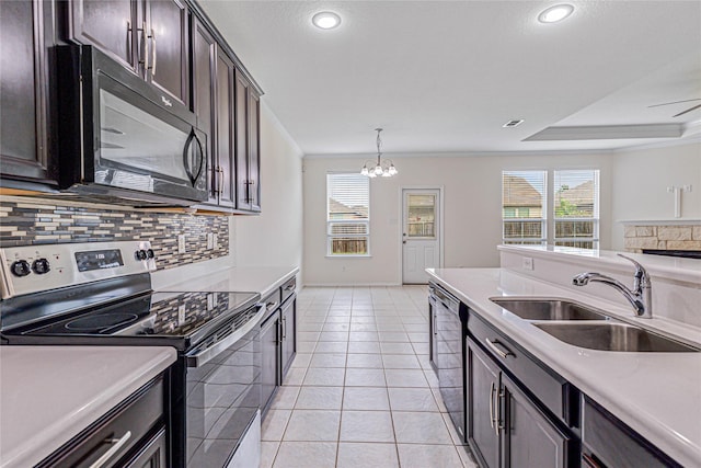 2305 Simmental Rd, Fort Worth, TX 76131 - kitchen featuring stainless steel appliances, a sink, backsplash, light countertops, and crown molding