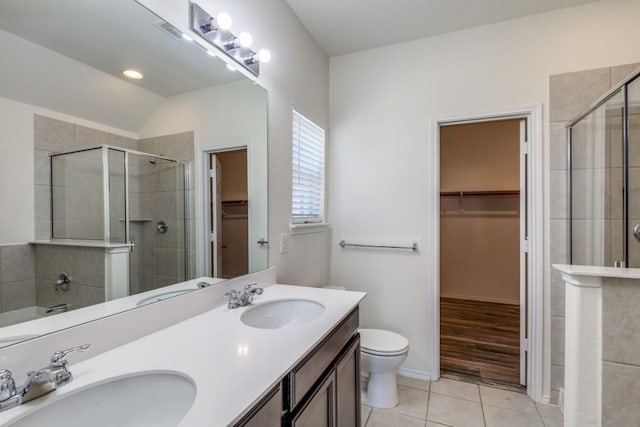 2305 Simmental Rd, Fort Worth, TX 76131 - full bath with a walk in closet, double vanity, tile patterned floors, a shower stall, and lofted ceiling