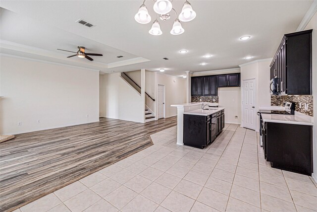 2305 Simmental Rd, Fort Worth, TX 76131 - kitchen featuring open floor plan, crown molding, tasteful backsplash, stainless steel electric range oven, and light tile patterned floors
