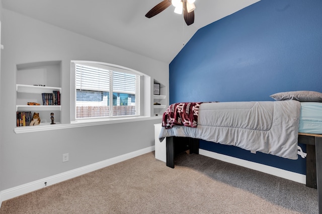 carpeted bedroom with lofted ceiling, ceiling fan, and baseboards