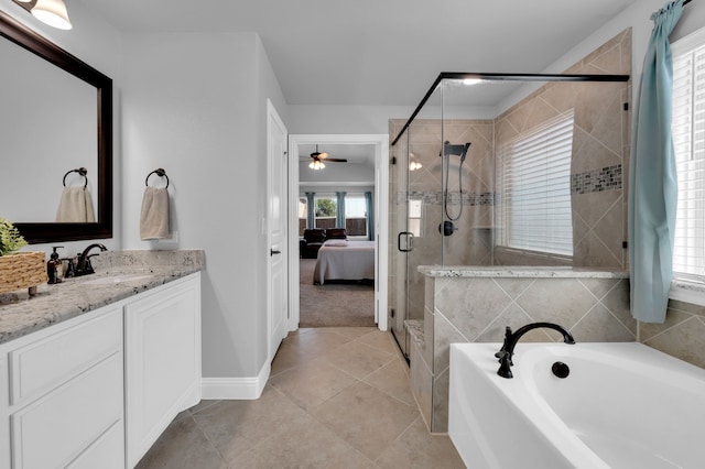 full bathroom featuring a stall shower, vanity, ensuite bath, tile patterned flooring, and a bath