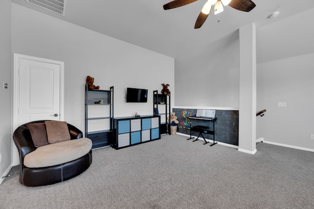 living area featuring a ceiling fan, baseboards, visible vents, and carpet flooring