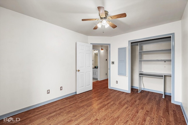 unfurnished bedroom featuring ceiling fan, a closet, baseboards, and wood finished floors