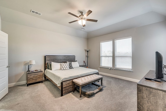 bedroom with ceiling fan, visible vents, baseboards, vaulted ceiling, and carpet