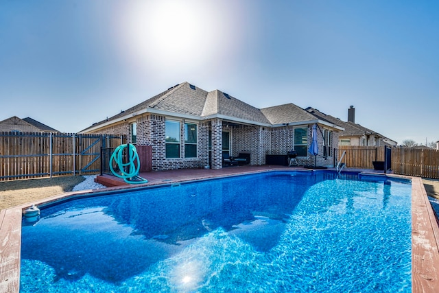 view of pool featuring a fenced backyard and a fenced in pool