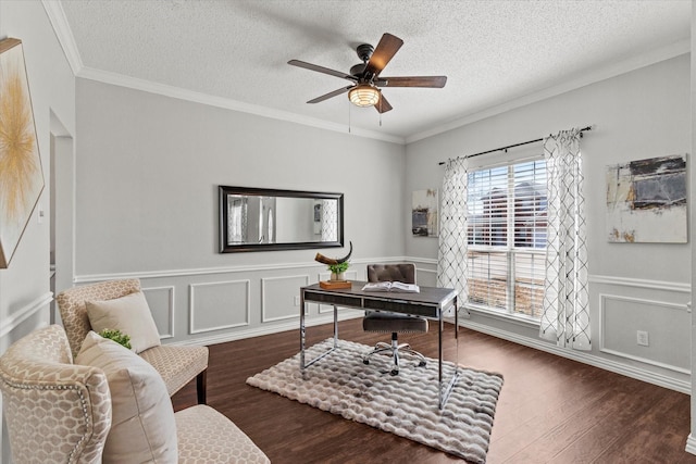 office space featuring ornamental molding, dark wood-style flooring, ceiling fan, and a textured ceiling