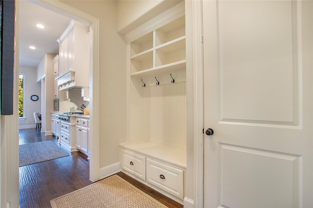 mudroom with baseboards, dark wood finished floors, and recessed lighting