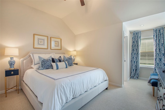 carpeted bedroom with lofted ceiling, ceiling fan, and baseboards