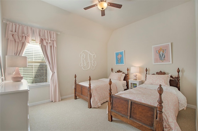 carpeted bedroom featuring vaulted ceiling, ceiling fan, and baseboards