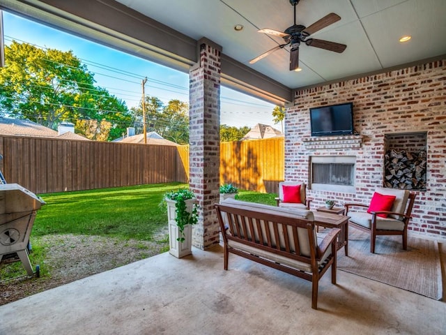 view of patio with ceiling fan, fence, and an outdoor living space