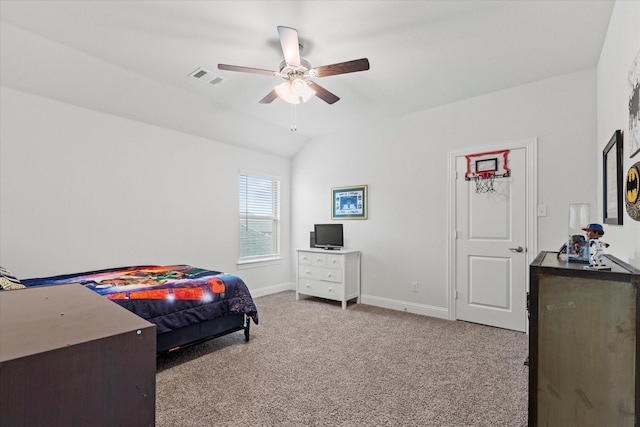 bedroom with carpet, lofted ceiling, visible vents, a ceiling fan, and baseboards