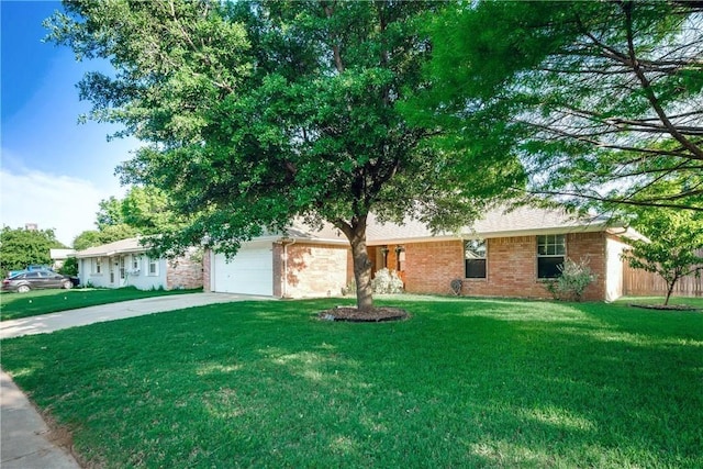 single story home featuring a garage, brick siding, driveway, and a front lawn