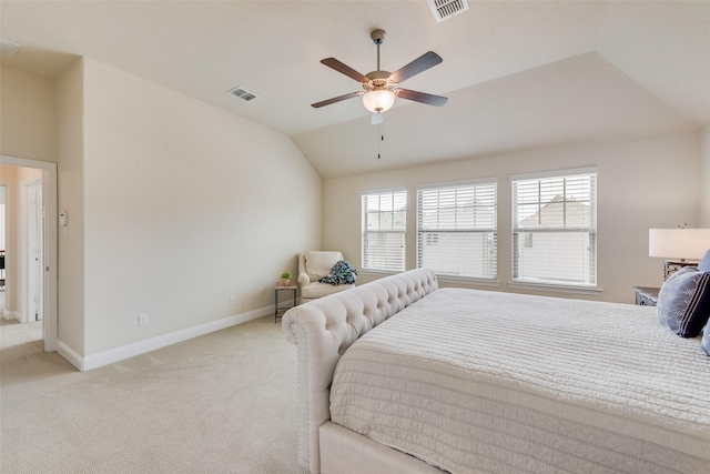 bedroom with lofted ceiling, baseboards, visible vents, and light colored carpet