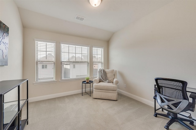 sitting room with lofted ceiling, baseboards, visible vents, and carpet flooring