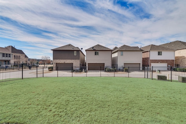 surrounding community featuring a garage, a residential view, fence, and a lawn