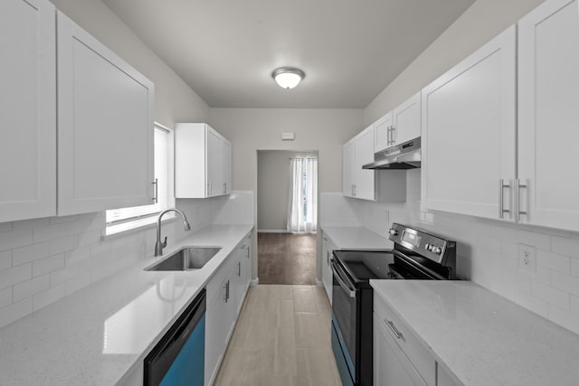 kitchen with electric range oven, white cabinets, a sink, under cabinet range hood, and dishwashing machine