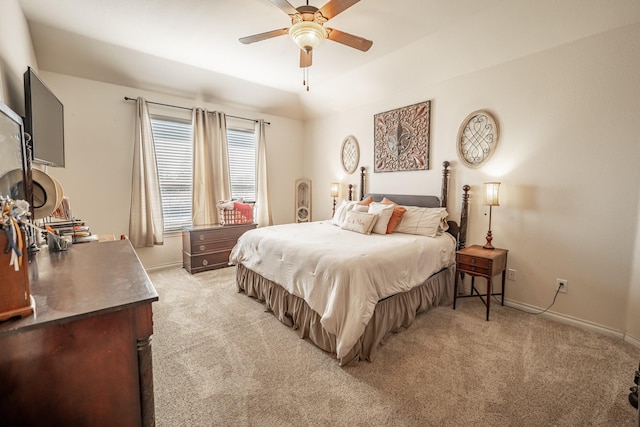 bedroom featuring baseboards, a ceiling fan, and light colored carpet