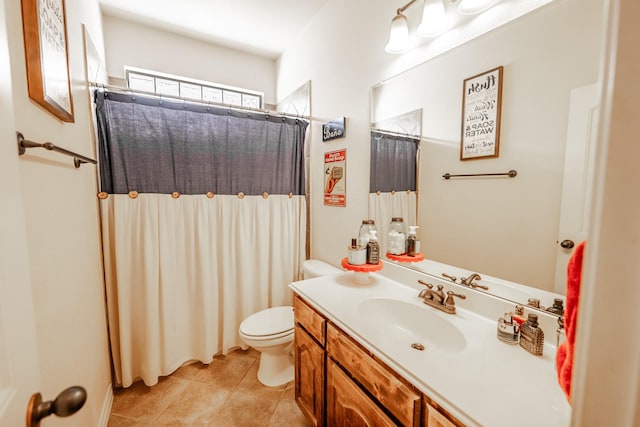 full bathroom featuring tile patterned flooring, curtained shower, vanity, and toilet