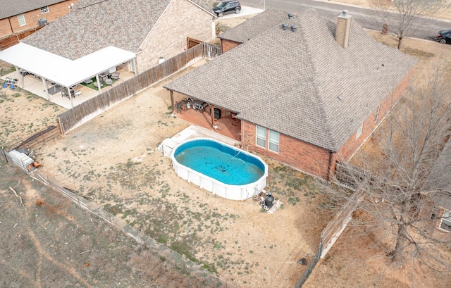 view of swimming pool featuring a fenced backyard and a fenced in pool