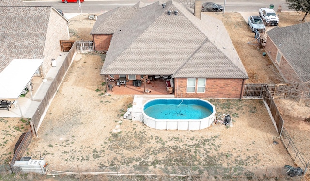 view of pool with a fenced in pool, a patio area, and a fenced backyard