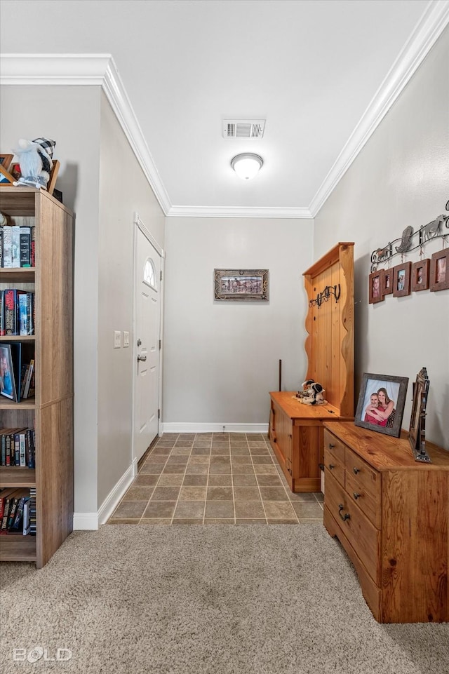 carpeted entryway with ornamental molding, visible vents, and baseboards