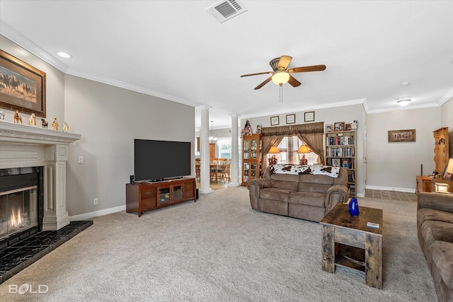 living area featuring carpet flooring, a high end fireplace, baseboards, ornate columns, and crown molding