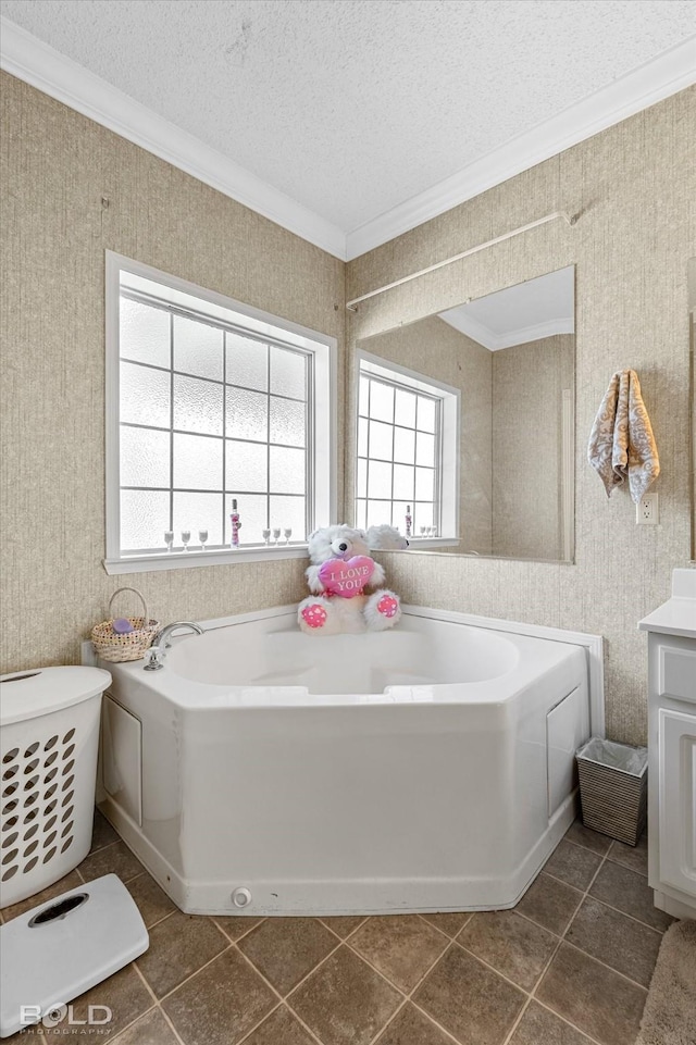 full bathroom with a textured ceiling, ornamental molding, a garden tub, and wallpapered walls