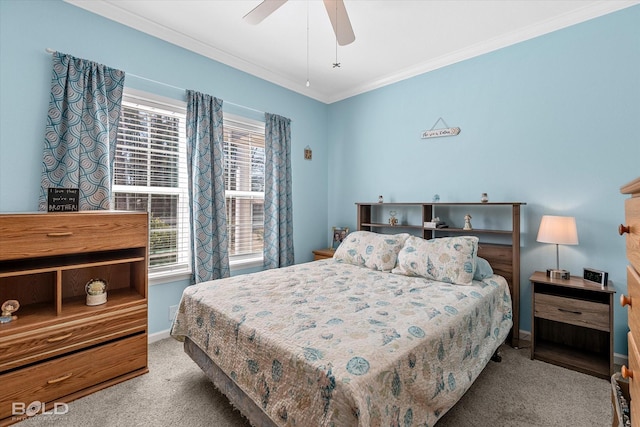 carpeted bedroom featuring a ceiling fan, crown molding, and baseboards