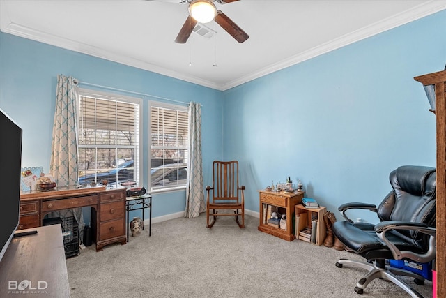 carpeted home office with a ceiling fan, baseboards, visible vents, and crown molding