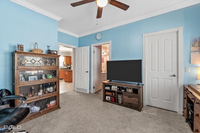 living area featuring a ceiling fan, light colored carpet, and crown molding