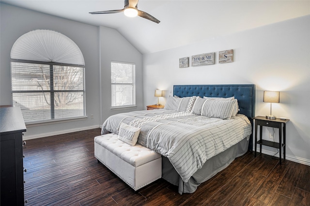 bedroom with ceiling fan, baseboards, vaulted ceiling, and wood finished floors