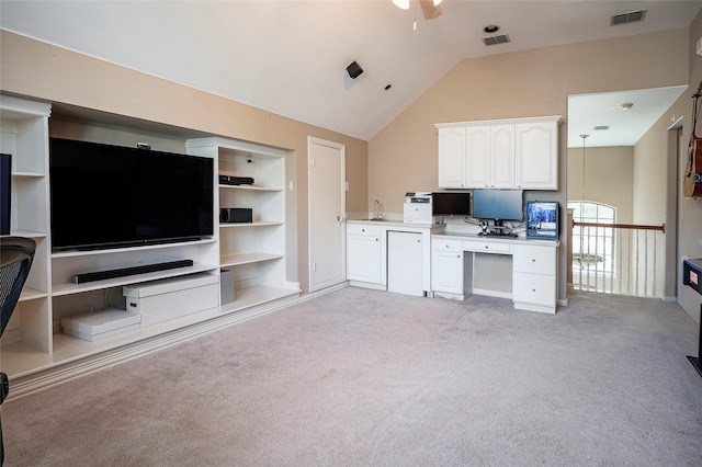 living area featuring light carpet, high vaulted ceiling, visible vents, and a ceiling fan