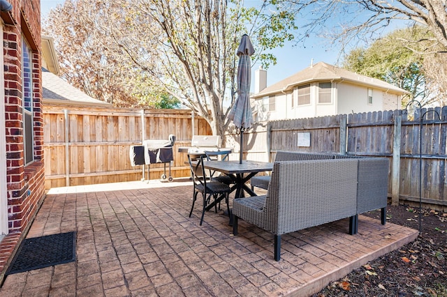 view of patio / terrace with outdoor dining space and a fenced backyard