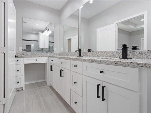 bathroom featuring double vanity