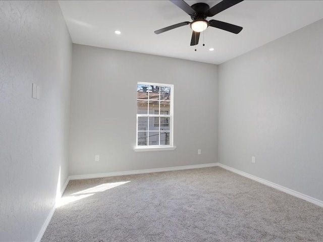 unfurnished room featuring a ceiling fan, recessed lighting, carpet flooring, and baseboards
