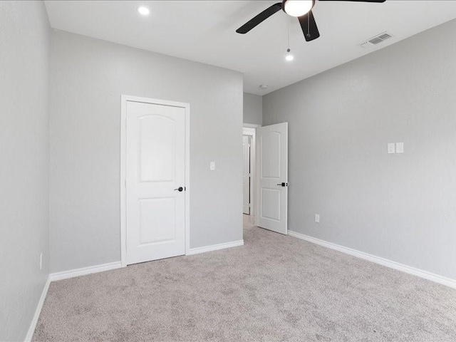 unfurnished bedroom with carpet floors, baseboards, visible vents, and recessed lighting