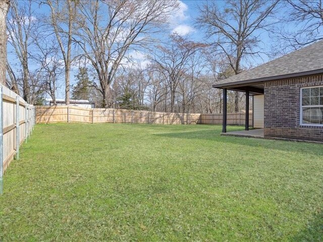 view of yard featuring a fenced backyard