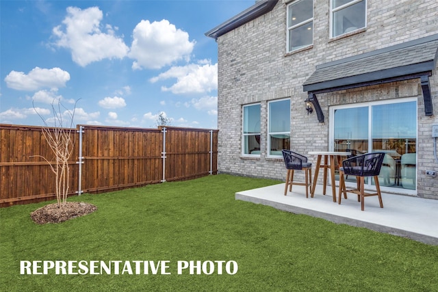 view of yard with a patio and fence