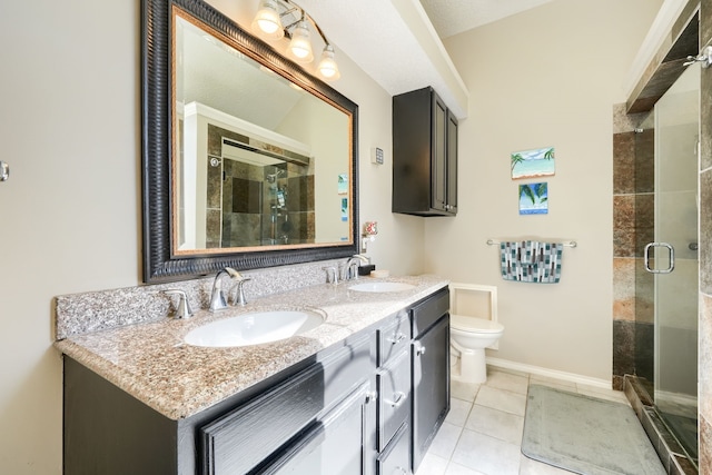 bathroom with a stall shower, a sink, and toilet