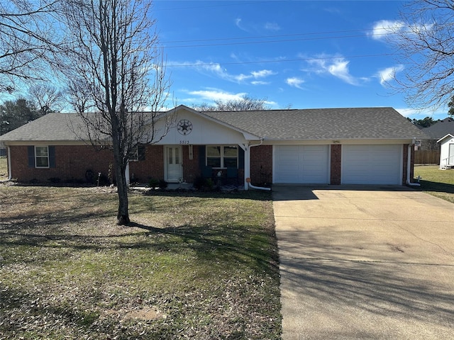 single story home featuring an attached garage, brick siding, a shingled roof, concrete driveway, and a front yard